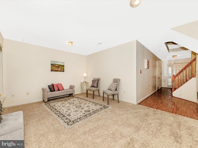 13107 Bridger Dr Unit 104, Germantown, MD 20874 - living area with carpet, stairs, and baseboards