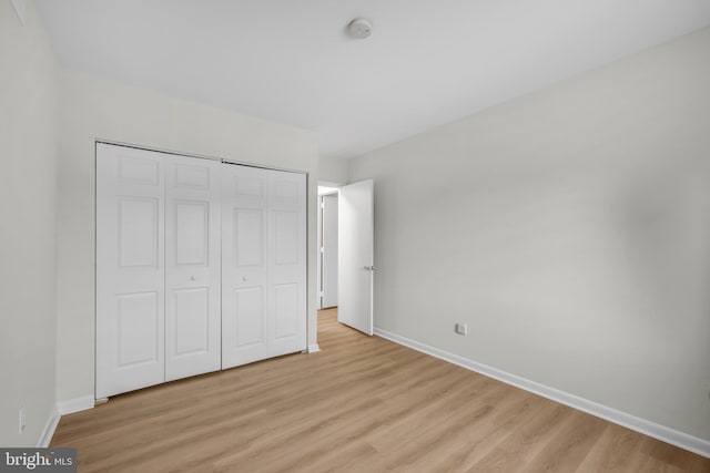 5414 Valley Green Dr Unit D4, Wilmington, DE 19808 - unfurnished bedroom featuring light wood-style floors, baseboards, and a closet