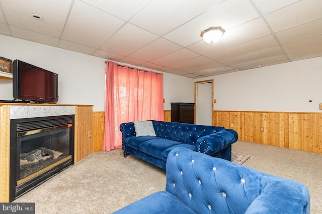 950 Wampler Ln, Westminster, MD 21158 - carpeted living room with a wainscoted wall, wood walls, a glass covered fireplace, and a paneled ceiling