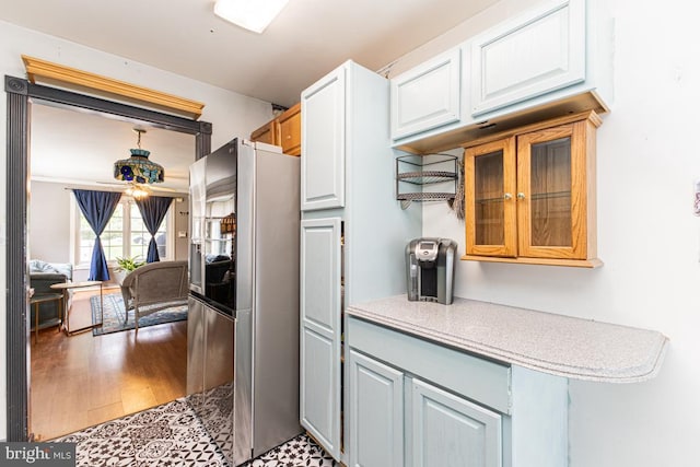 950 Wampler Ln, Westminster, MD 21158 - kitchen featuring freestanding refrigerator, light countertops, glass insert cabinets, light wood finished floors, and white cabinets