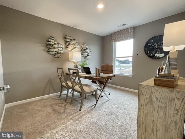 home office with baseboards, visible vents, and carpet floors