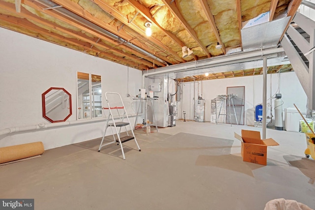 unfinished basement with water heater and heating unit