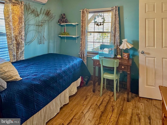 bedroom with wood finished floors