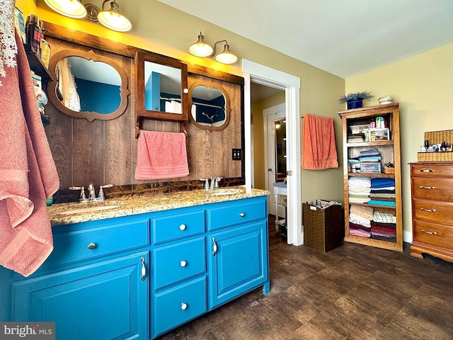 bathroom with double vanity and a sink