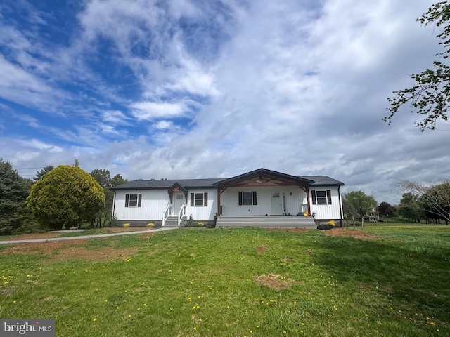 view of front facade with a porch and a front lawn