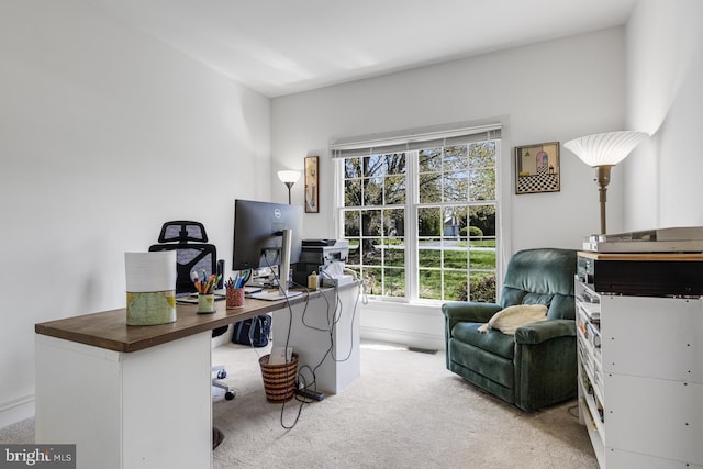 carpeted home office featuring visible vents