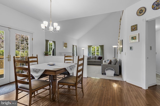dining room featuring baseboards, plenty of natural light, and hardwood / wood-style floors