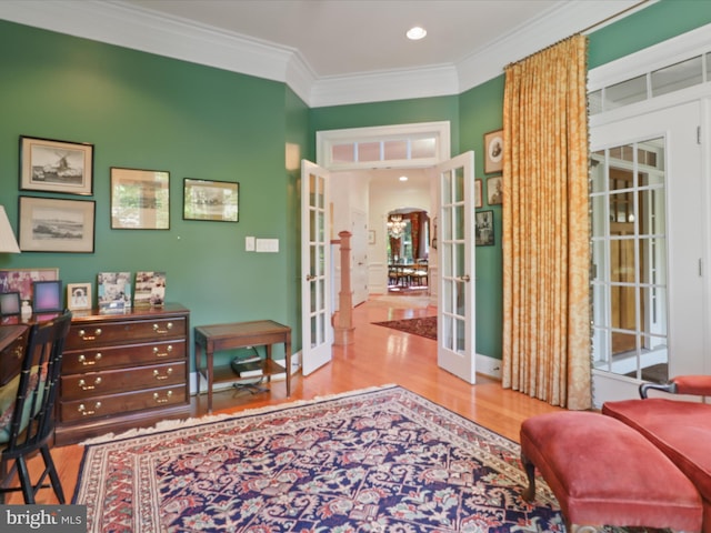 interior space featuring french doors, recessed lighting, decorative columns, wood finished floors, and ornamental molding