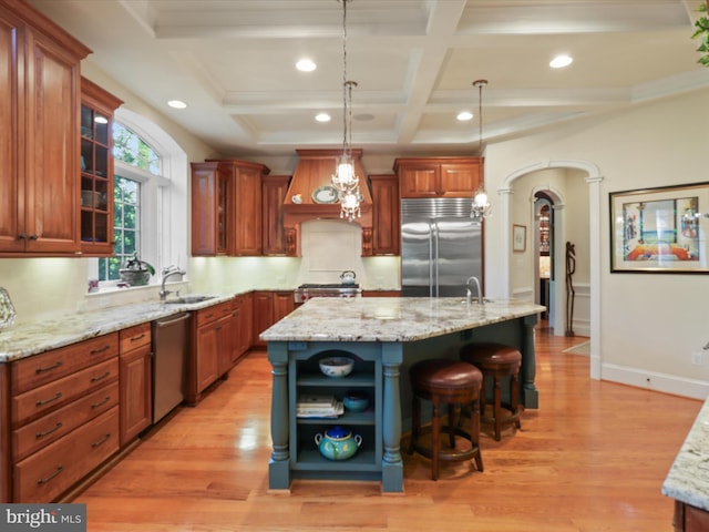 kitchen featuring appliances with stainless steel finishes, open shelves, custom range hood, and light wood-style flooring