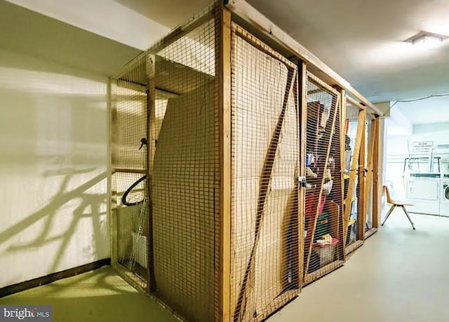 storage room featuring washing machine and clothes dryer