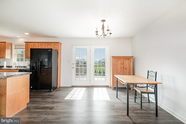 dining space featuring a chandelier, recessed lighting, dark wood-style floors, and baseboards