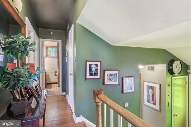 1511 Glenview Dr, Cinnaminson, NJ 08077 - hallway with wood finished floors, vaulted ceiling, an upstairs landing, and baseboards