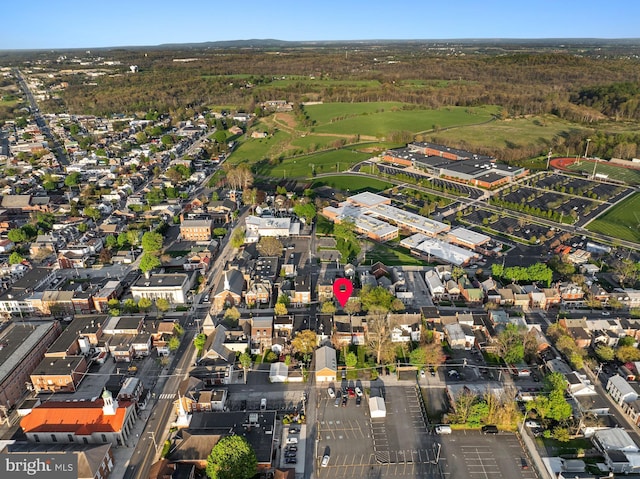 birds eye view of property featuring view of golf course and a residential view