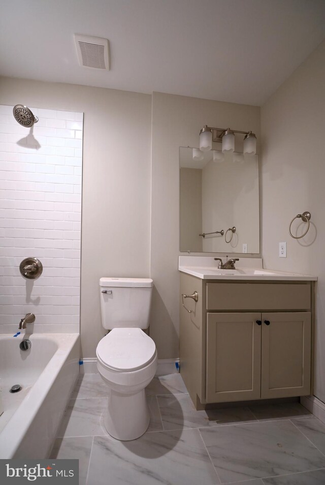 2237 E Biddle St, Baltimore, MD 21213 - full bath featuring toilet, vanity, baseboards, and shower / bath combination