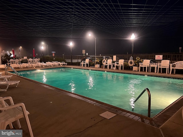 900 Kennedy Dr Unit 304, North Wildwood, NJ 08260 - pool at twilight with fence, a community pool, and a patio area