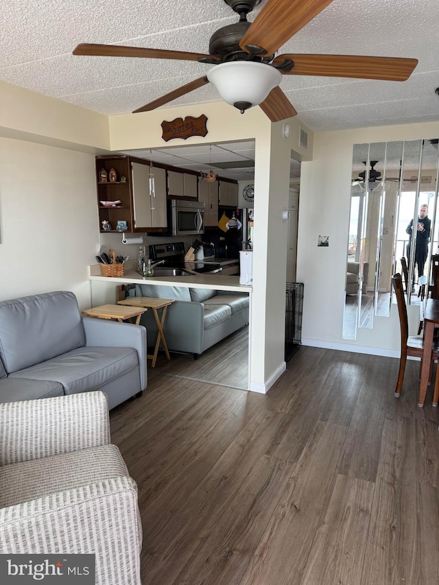 900 Kennedy Dr Unit 304, North Wildwood, NJ 08260 - living room with a textured ceiling, visible vents, a ceiling fan, and dark wood-type flooring