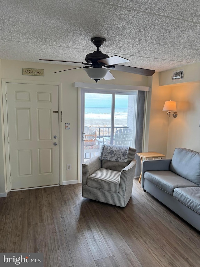 900 Kennedy Dr Unit 304, North Wildwood, NJ 08260 - living room featuring wood finished floors, ceiling fan, baseboards, visible vents, and a textured ceiling