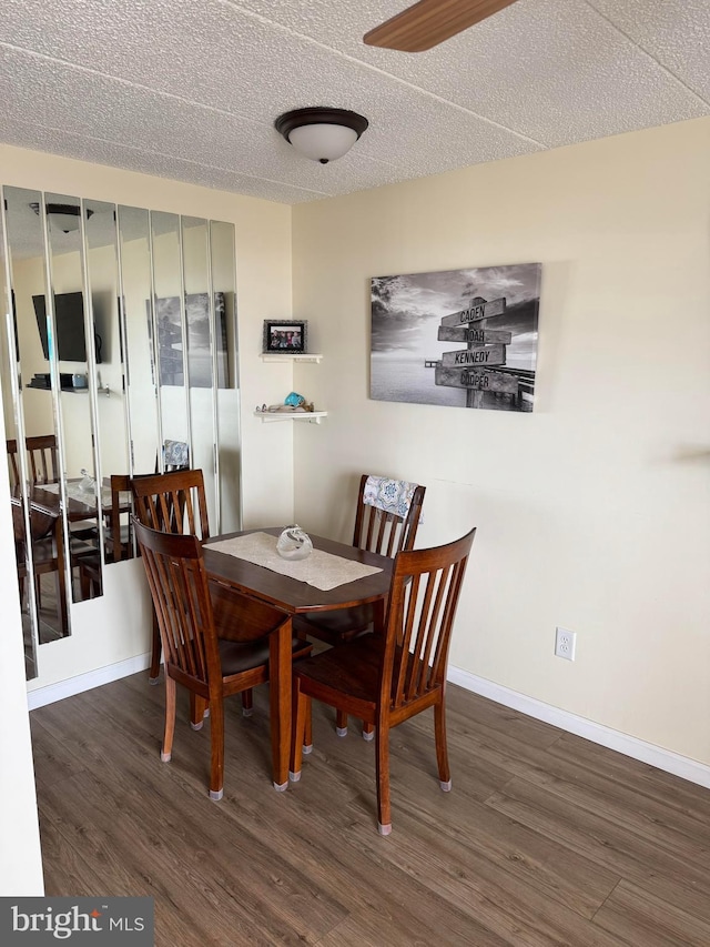 900 Kennedy Dr Unit 304, North Wildwood, NJ 08260 - dining room with baseboards, wood finished floors, ceiling fan, and a textured ceiling