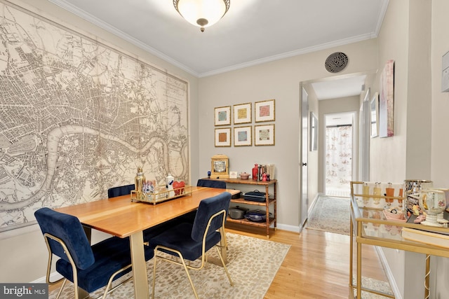 3825 Davis Pl NW Unit 202, Washington, DC 20007 - dining room with wood finished floors, ornamental molding, and baseboards