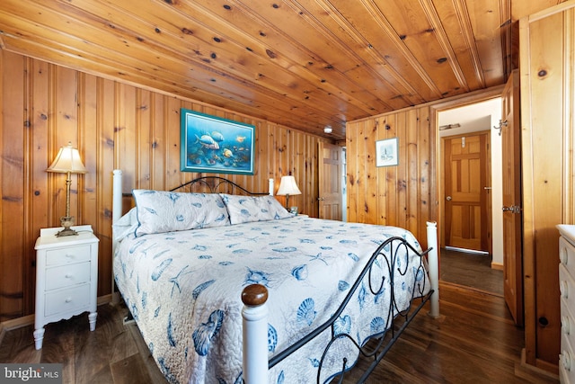 bedroom with wood ceiling, wood-type flooring, and wood walls