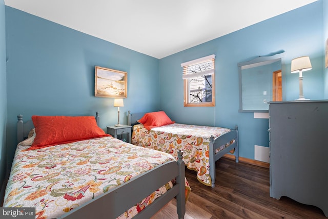 bedroom with wood finished floors