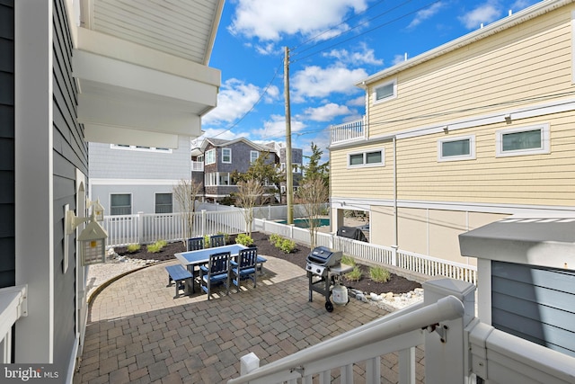 view of patio featuring a fenced backyard and outdoor dining space