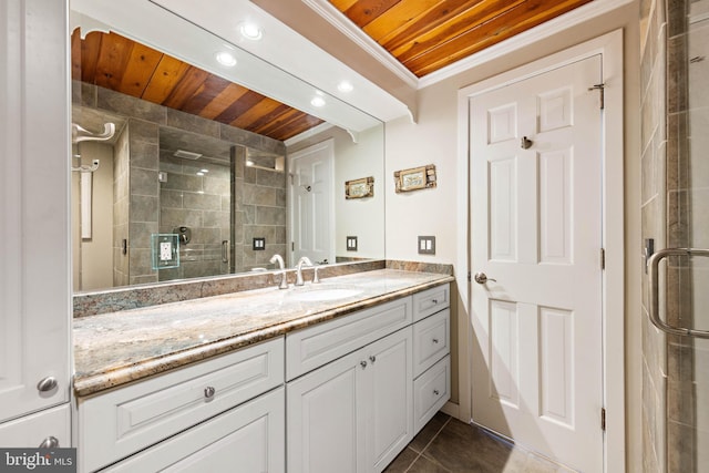 full bath featuring wood ceiling, tile patterned flooring, a stall shower, vanity, and ornamental molding