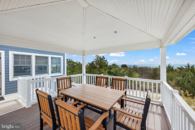 deck featuring outdoor dining area