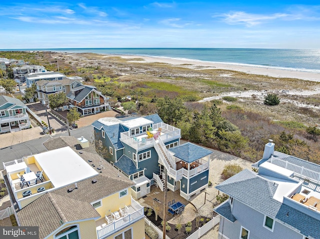 bird's eye view with a water view and a view of the beach