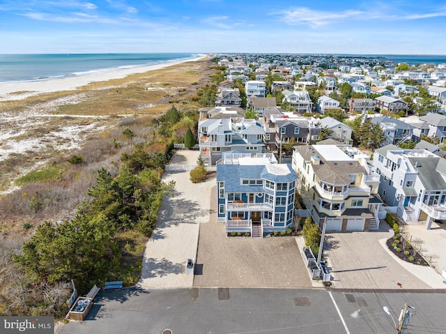 bird's eye view with a view of the beach and a water view