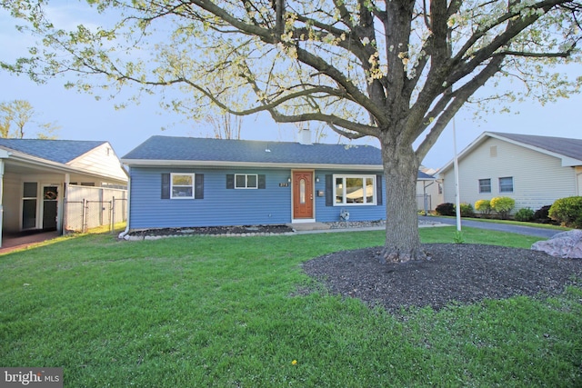 single story home featuring fence and a front yard