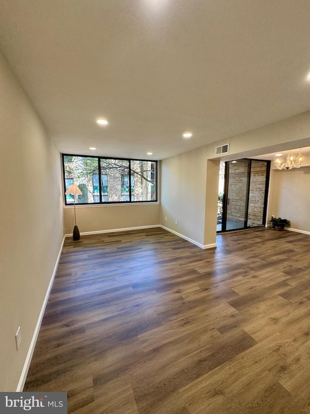 511 N Armistead St Unit T2, Alexandria, VA 22312 - spare room featuring visible vents, wood finished floors, baseboards, recessed lighting, and a notable chandelier
