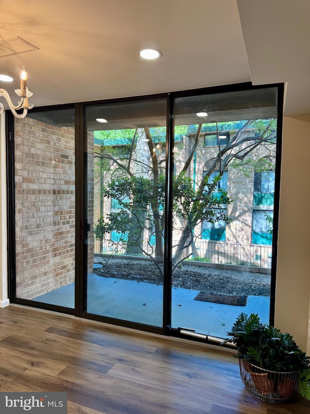 511 N Armistead St Unit T2, Alexandria, VA 22312 - doorway to outside featuring floor to ceiling windows, recessed lighting, wood finished floors, and a chandelier