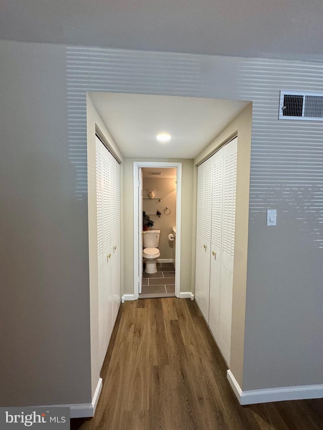 511 N Armistead St Unit T2, Alexandria, VA 22312 - hallway with baseboards, visible vents, and wood finished floors