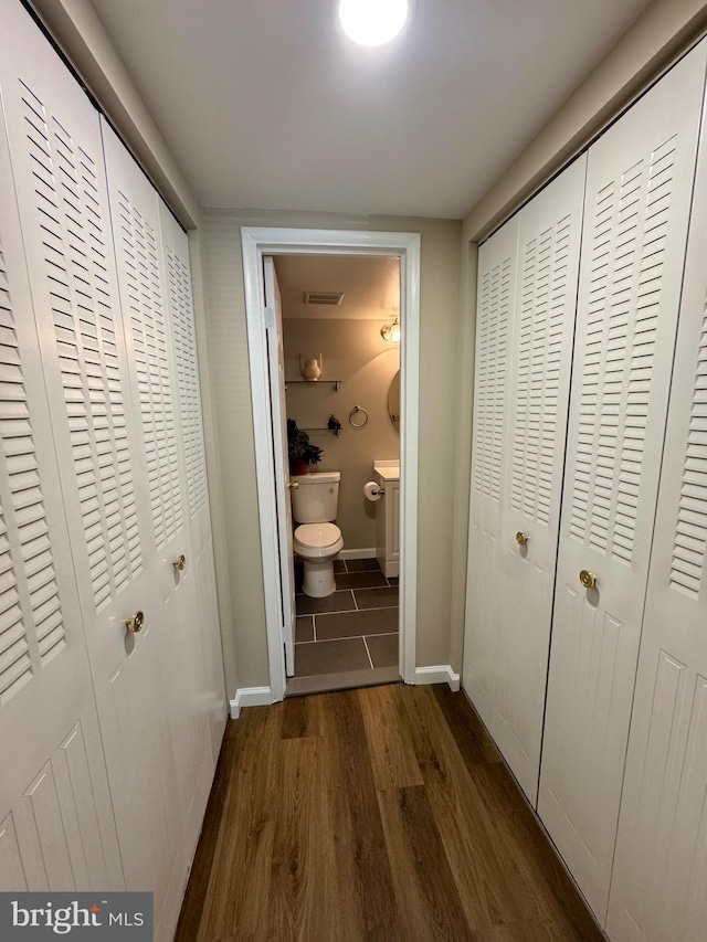 511 N Armistead St Unit T2, Alexandria, VA 22312 - hall with baseboards, visible vents, and dark wood-type flooring
