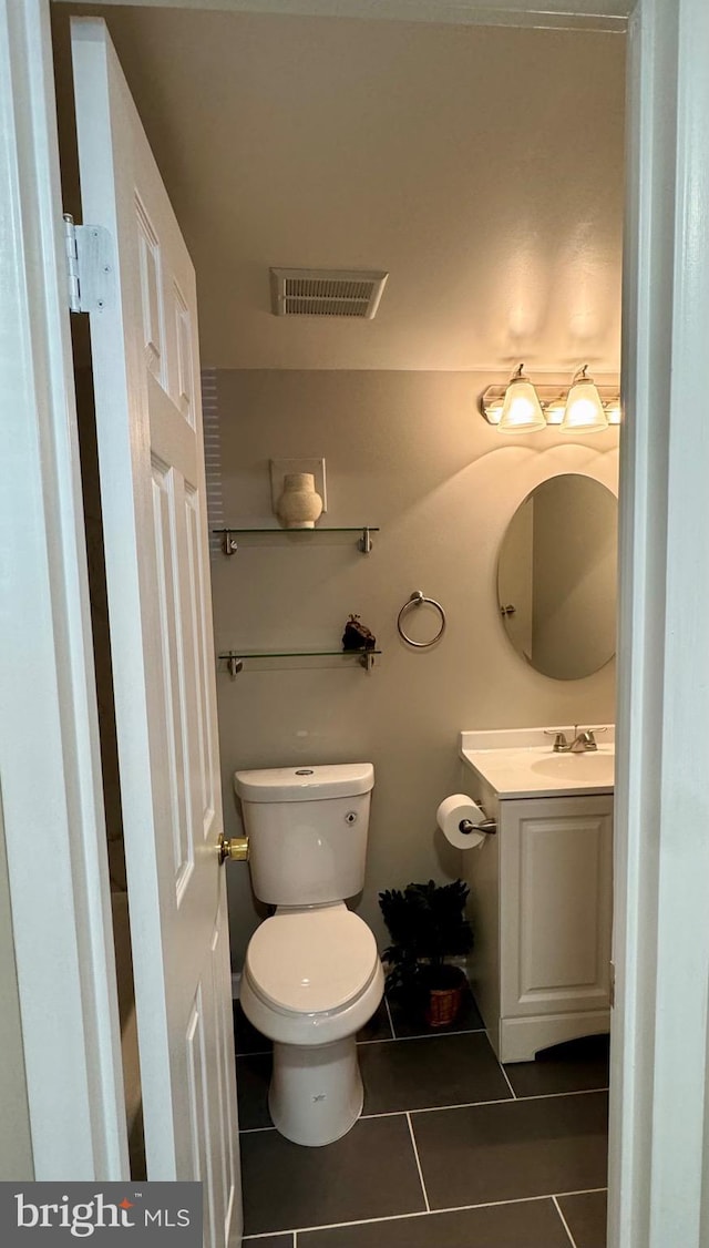 511 N Armistead St Unit T2, Alexandria, VA 22312 - half bathroom featuring toilet, visible vents, tile patterned flooring, and vanity