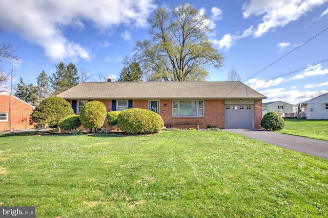 single story home with a front lawn, a garage, aphalt driveway, and brick siding