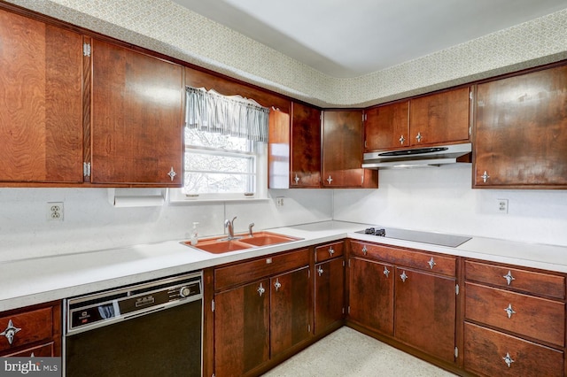 kitchen featuring black appliances, a sink, light countertops, and under cabinet range hood