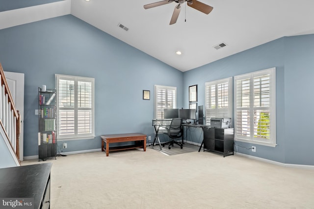office space with plenty of natural light, carpet flooring, ceiling fan, and visible vents