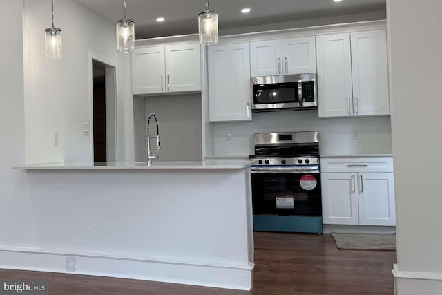 16 E Parkway Ave, Chester, PA 19013 - kitchen with a sink, stainless steel appliances, dark wood-style floors, and white cabinetry