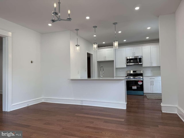 16 E Parkway Ave, Chester, PA 19013 - kitchen featuring recessed lighting, white cabinets, stainless steel appliances, and dark wood-style flooring