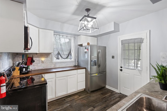 821 Green Ave, Mount Ephraim, NJ 08059 - kitchen with appliances with stainless steel finishes, backsplash, dark wood-type flooring, and white cabinetry