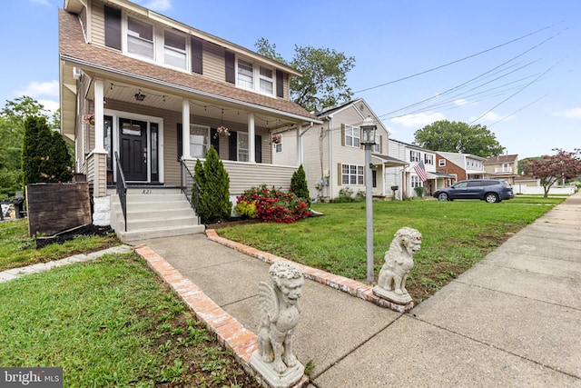 821 Green Ave, Mount Ephraim, NJ 08059 - view of front of home featuring a shingled roof, a porch, and a front lawn