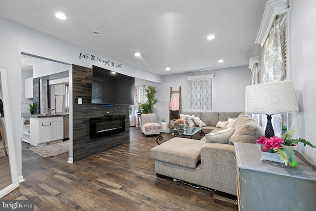 821 Green Ave, Mount Ephraim, NJ 08059 - living area featuring a large fireplace, dark wood-style flooring, and recessed lighting