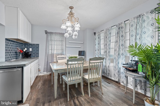 821 Green Ave, Mount Ephraim, NJ 08059 - dining room with a chandelier, dark wood-style floors, and a textured ceiling