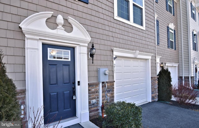 property entrance with a garage