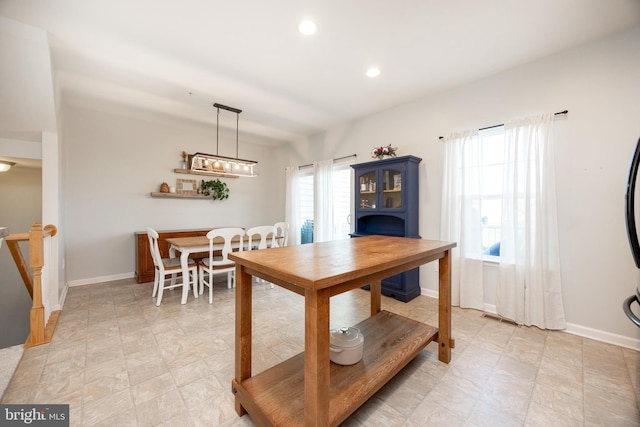 dining room featuring baseboards, recessed lighting, a healthy amount of sunlight, and visible vents