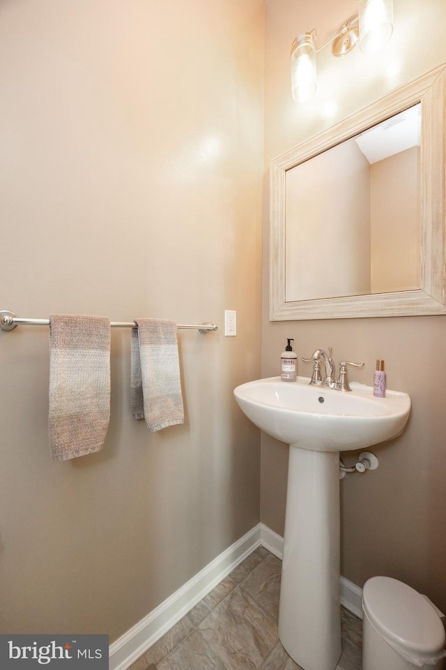 bathroom featuring baseboards