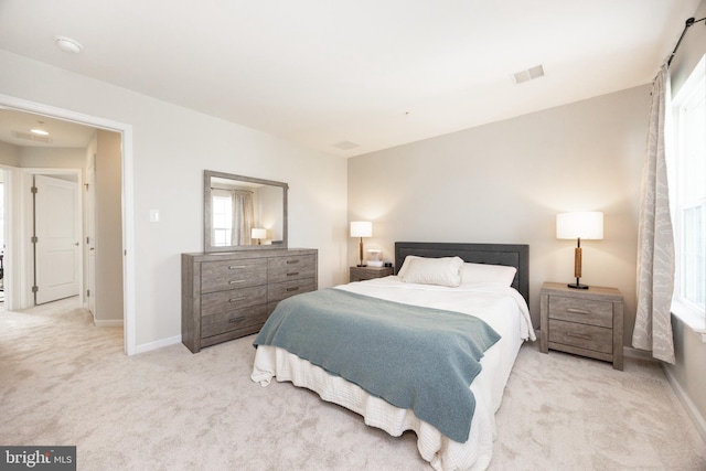 bedroom featuring carpet floors, baseboards, and visible vents
