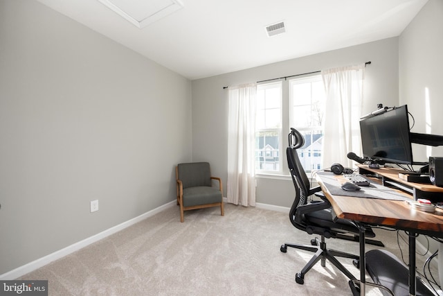office with baseboards, light colored carpet, and visible vents